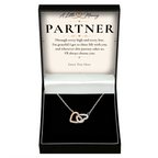 The Heart to Heart Partner Necklace: two-tone interlocking hearts pendant in a gift box with a personalised message card